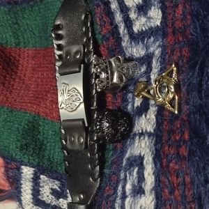 Bundle of two rings one bracelet and an illuminati pendants
